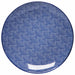 The Danica Appetizer Plate Blue Waves is a round ceramic plate that features a detailed blue and white intricate geometric pattern, creating a textured appearance. The design consists of small, closely spaced dots forming overlapping circular shapes.